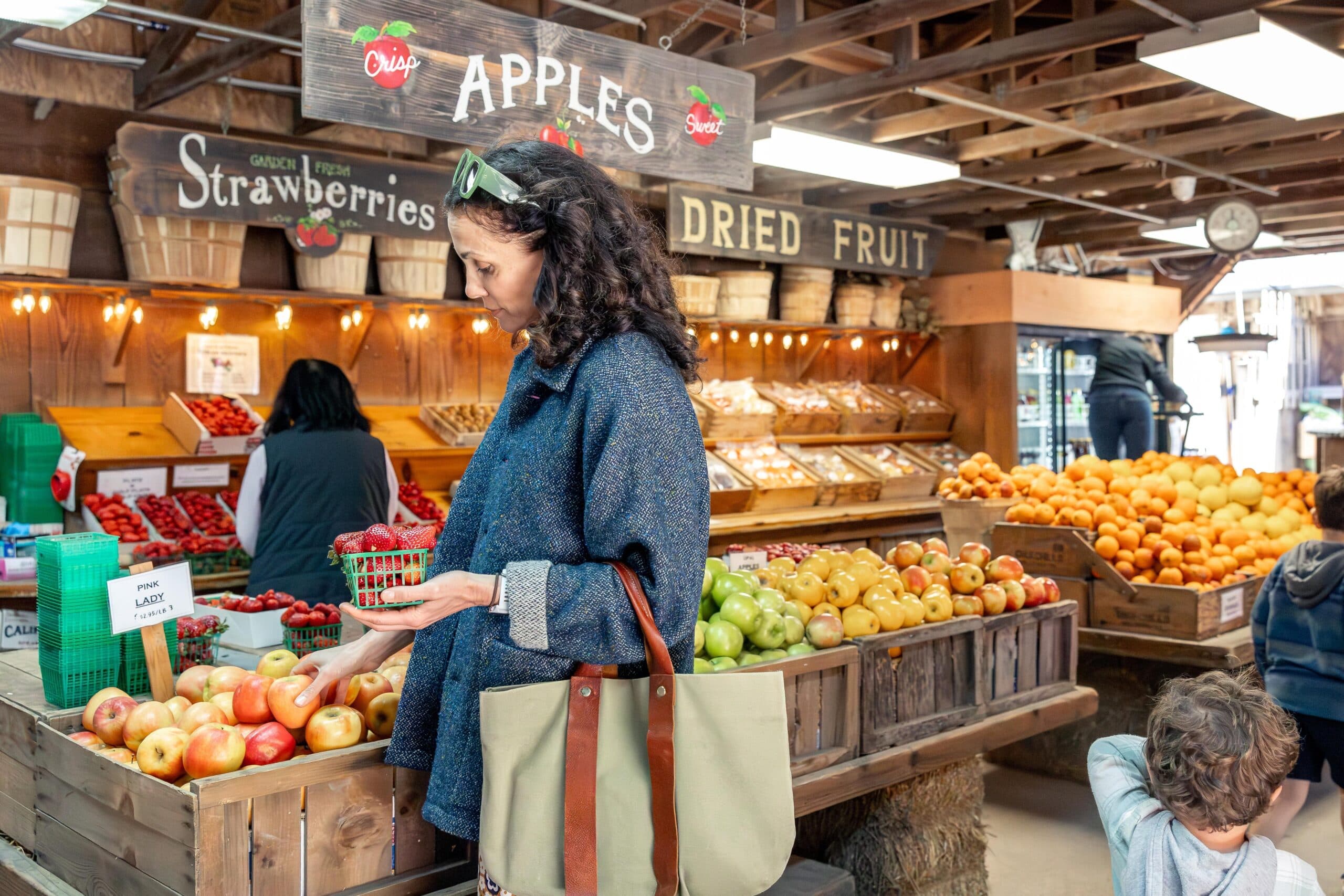 Aida Mollenkamp selecting produce at Avila Valley Barn