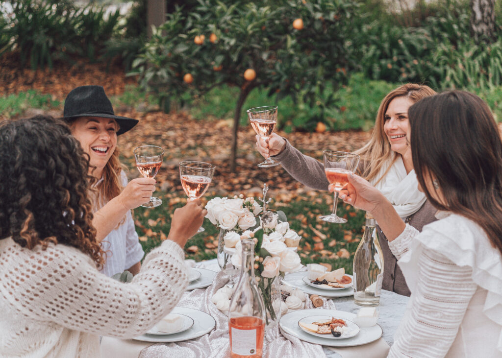 a group of women enjoying a picnic at Acquiesce Winery in Lodi