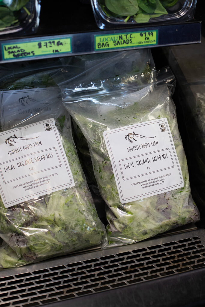 Bags of salad mix in a cooler