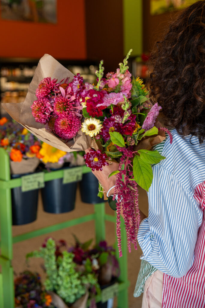 Person holding bouquet of flowers