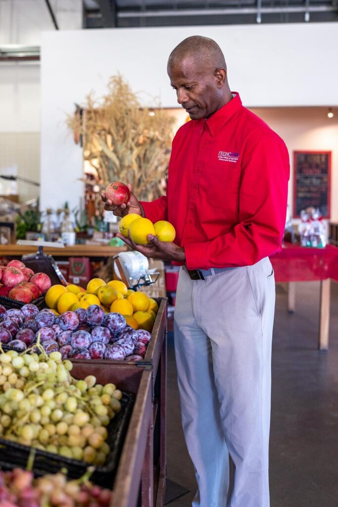 man perusing produce at Gibson Farm Market