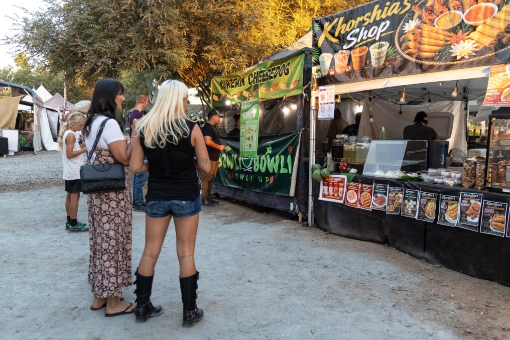 women checking out the food trucks at lotus pond Sanger