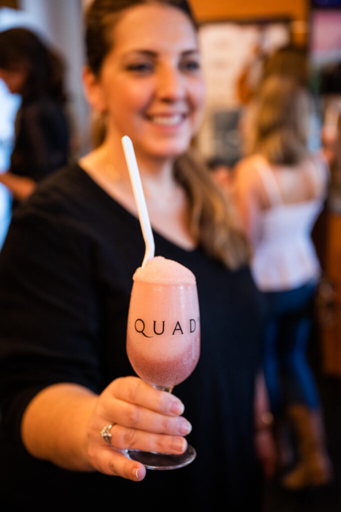 woman with a wine slushie at Quady Winery