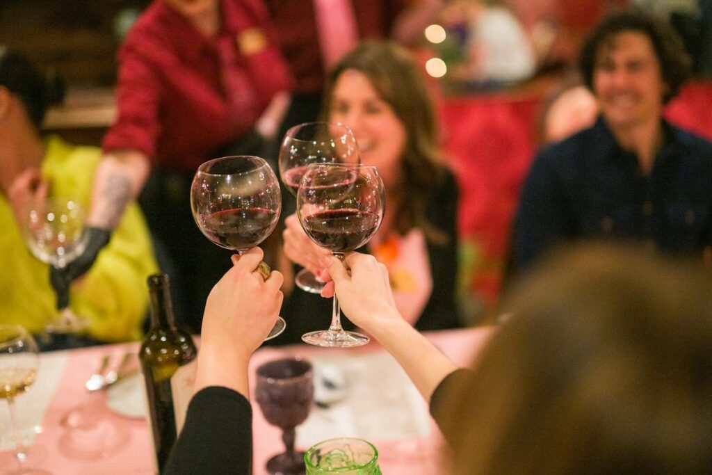 friends toasting wine at madonna inn restaurant
